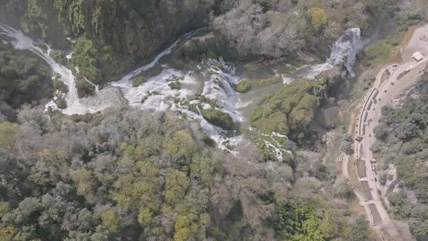 Aerial view of Marmore Falls in the lush forest Italy.