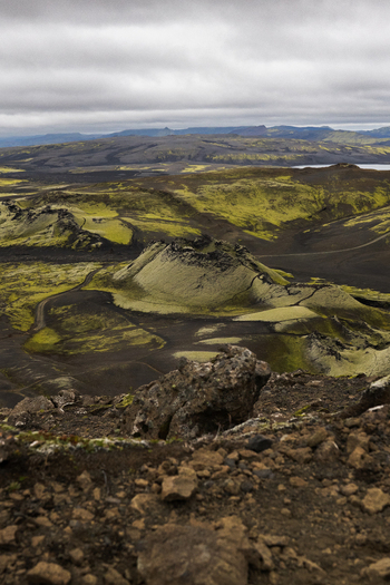 View of a volcanic landscape with mossy hills under a cloudy sky creating a surreal and textured panorama Skaftárhreppur Skaftárhreppur Iceland. View of a volcanic landscape with mossy hills under a cloudy sky creating a surreal and textured panorama Skaftárhreppur Skaftárhreppur Iceland.