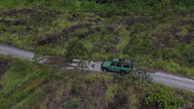 Aerial view of off road vehicle on Mount Batur road Indonesia. Aerial view of off road vehicle on Mount Batur road Indonesia.