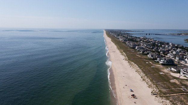 Aerial view of the sandy coastline and residential houses along the shore in Mantoloking New Jersey United States.