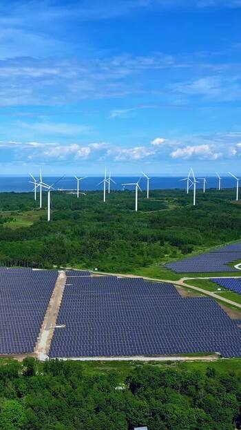 Aerial view of wind turbines and solar panels in Estonia. Aerial view of wind turbines and solar panels in Estonia.