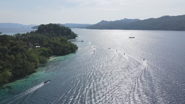 Aerial view of Raja Ampat islands and boats in Indonesia. Aerial view of Raja Ampat islands and boats in Indonesia.
