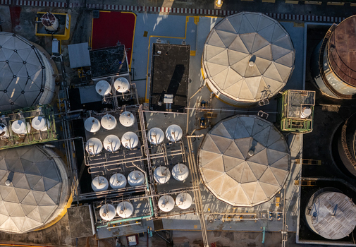 Aerial view of the beer industrial complex with large storage tanks intricate piping systems and industrial structures in Santo Domingo Dominican Republic. Aerial view of the beer industrial complex with large storage tanks intricate piping systems and industrial structures in Santo Domingo Dominican Republic.