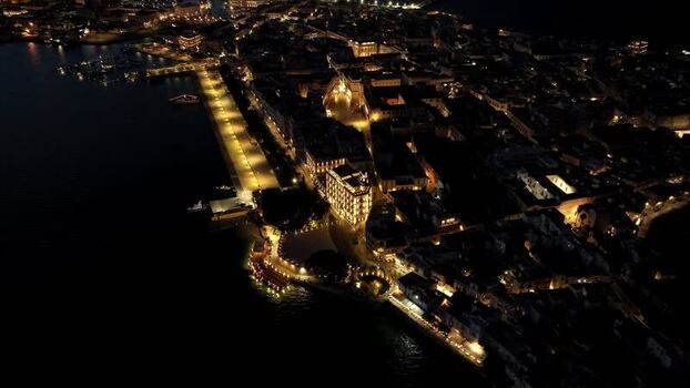 Aerial view of the Island of Ortigia at night in Syracuse Italy. Aerial view of the Island of Ortigia at night in Syracuse Italy.