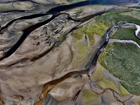 Aerial view of Findhorn Bay with winding dark water channels sandy banks and green marshy vegetation Findhorn Scotland United Kingdom. Aerial view of Findhorn Bay with winding dark water channels sandy banks and green marshy vegetation Findhorn Scotland United Kingdom.