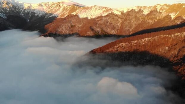 Aerial view of Balkan Mountains above clouds in Lovech Bulgaria.