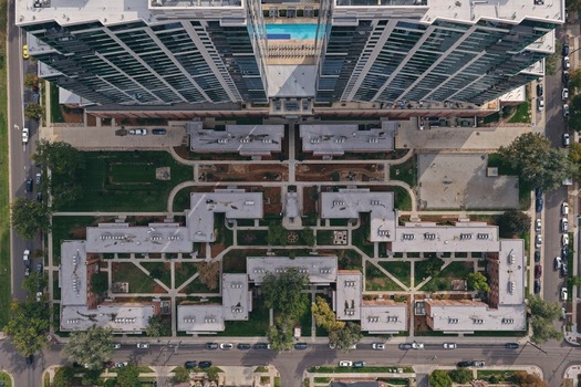 Aerial view of the Cherry Creek residential complex in Denver featuring modern high rise buildings landscaped courtyards and surrounding urban streets in Denver Colorado United States. Aerial view of the Cherry Creek residential complex in Denver featuring modern high rise buildings landscaped courtyards and surrounding urban streets in Denver Colorado United States.