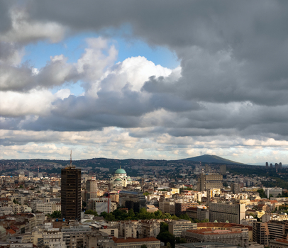 Aerial view of Saint Sava Temple rising above the urban landscape of Belgrade under a dramatic cloudy sky Belgrade City of Belgrade Serbia. Aerial view of Saint Sava Temple rising above the urban landscape of Belgrade under a dramatic cloudy sky Belgrade City of Belgrade Serbia.