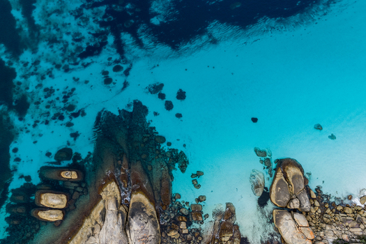 Aerial view of Frenchman Bay featuring turquoise water rocky outcrops and sandy coastline in Albany Western Australia Australia. Aerial view of Frenchman Bay featuring turquoise water rocky outcrops and sandy coastline in Albany Western Australia Australia.