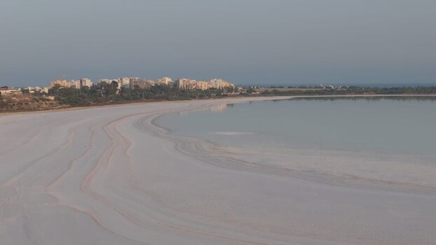 Aerial view of Larnaca Salt Lake and city skyline Cyprus.