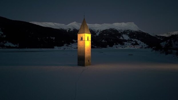 Aerial view of the submerged bell tower in Graun im Vinschgau Italy. Aerial view of the submerged bell tower in Graun im Vinschgau Italy.