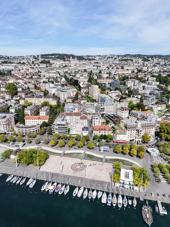 Aerial view of Ouchy Olympique district with its marina sailboats and promenade along the waterfront in Lausanne Vaud Switzerland.