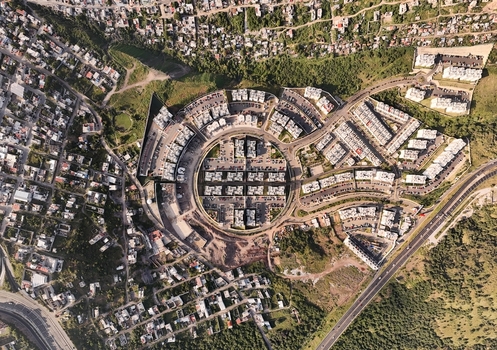Santiago de Queretaro Mexico 25 September 2026 Aerial view of Anillo Vial Fray Junipero Serra showing the circular residential complex surrounded by urban development and green spaces.