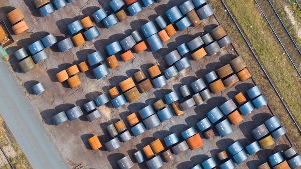 Aerial view of numerous blue and orange steel coils organized in rows at the Tata Steel industrial facility Velsen Noord Noord Holland Netherlands. Aerial view of numerous blue and orange steel coils organized in rows at the Tata Steel industrial facility Velsen Noord Noord Holland Netherlands.