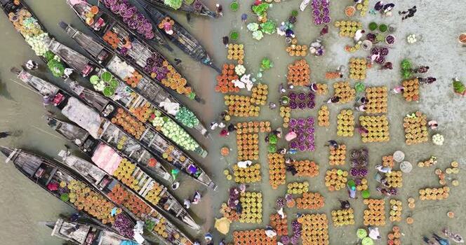 Aerial view of boats and produce at a market in Sylhet Bangladesh.