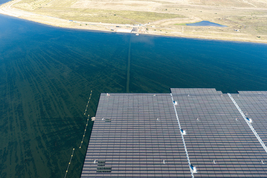 Aerial view of the floating solar park at Cottbuser Ostsee a former open pit mine showing the large array of solar panels on the water surface in Cottbus Brandenburg Germany. Aerial view of the floating solar park at Cottbuser Ostsee a former open pit mine showing the large array of solar panels on the water surface in Cottbus Brandenburg Germany.