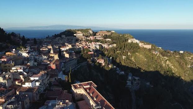 Aerial view of the historic town of Taormina on a cliff Italy.
