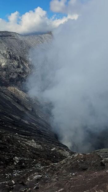 View of thick clouds over mountainous terrain Indonesia.