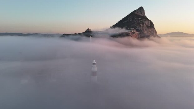 Aerial view of Europa Point lighthouse in fog Gibraltar.