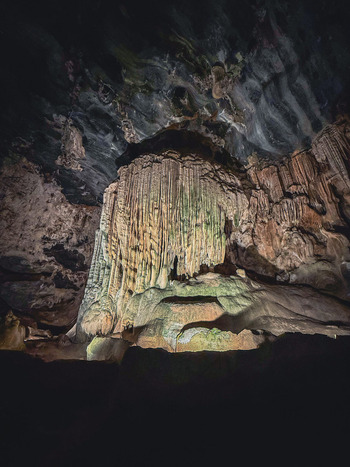 View of the massive limestone dripstone formations and stalactites inside the Cango Caves with illuminated rock walls in Oudtshoorn Western Cape South Africa. View of the massive limestone dripstone formations and stalactites inside the Cango Caves with illuminated rock walls in Oudtshoorn Western Cape South Africa.