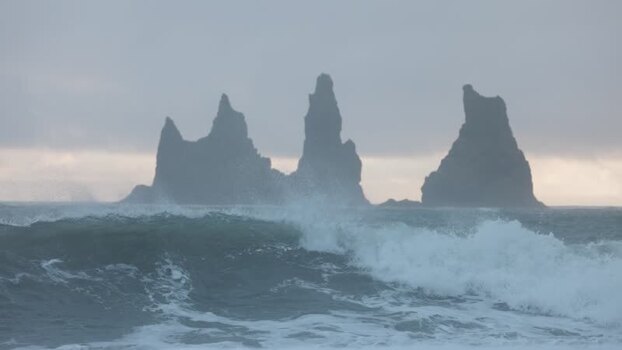 View of Reynisdrangar sea stacks in Iceland. View of Reynisdrangar sea stacks in Iceland.