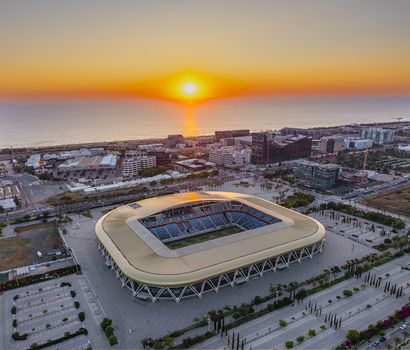 Aerial view of Sammy Ofer Stadium at sunset with the Mediterranean Sea in the background in Haifa Haifa District Israel. Aerial view of Sammy Ofer Stadium at sunset with the Mediterranean Sea in the background in Haifa Haifa District Israel.