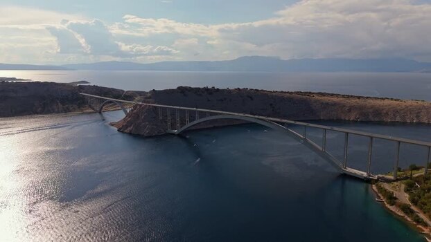 Aerial view of Krk Bridge spanning the Adriatic Sea in Croatia.