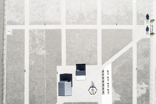 Aerial view of the modern residential area of Gardstensberget with geometric paved pathways small structures and minimalist landscaping in Gothenburg Vastra Gotaland Sweden.