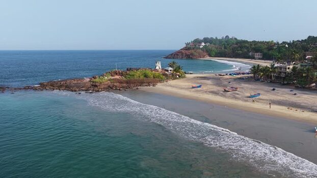 Aerial view of the tropical coastline and sandy beach in India. Aerial view of the tropical coastline and sandy beach in India.