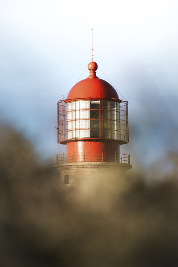 View of the beautiful lighthouse at Capo Sao Vincente during sunset Sagres Algarve Portugal.