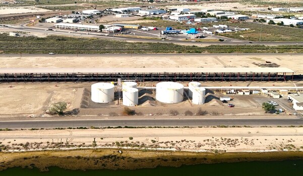 Grand Junction Colorado United States 03 July 2026 Aerial view of industrial storage tanks situated in an arid landscape near a highway and a body of water. Grand Junction Colorado United States 03 July 2026 Aerial view of industrial storage tanks situated in an arid landscape near a highway and a body of water.