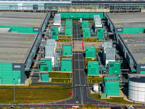 Aerial view of Agriport A7 a large scale industrial greenhouse complex featuring green paneled buildings technical infrastructure and access roads in Middenmeer Noord Holland Netherlands. Aerial view of Agriport A7 a large scale industrial greenhouse complex featuring green paneled buildings technical infrastructure and access roads in Middenmeer Noord Holland Netherlands.