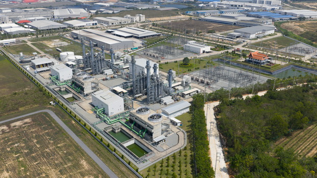 Aerial view of the Amata B.Grimm Power Rayong 3 Ltd. industrial complex featuring cooling towers and electrical substations in Tambon Mapyangphon Chang Wat Rayong Thailand. Aerial view of the Amata B.Grimm Power Rayong 3 Ltd. industrial complex featuring cooling towers and electrical substations in Tambon Mapyangphon Chang Wat Rayong Thailand.