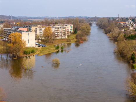 Kedainiai Lithuania 17 March 2026 Aerial view of the flooded Nevezis river flowing past residential apartment buildings and submerged trees during the spring thaw. Kedainiai Lithuania 17 March 2026 Aerial view of the flooded Nevezis river flowing past residential apartment buildings and submerged trees during the spring thaw.