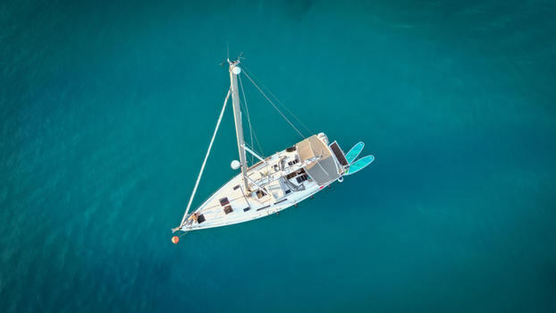 Hvar Croatia 21 August 2023 Aerial view of a white sailboat anchored in the turquoise waters of Vinogradisce bay. Hvar Croatia 21 August 2023 Aerial view of a white sailboat anchored in the turquoise waters of Vinogradisce bay.