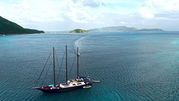 Aerial view of a large sailing yacht in the ocean Seychelles.