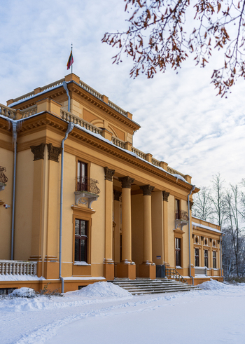 View of Traku Voke Manor with its yellow facade classical columns and snow covered grounds in Vilnius Vilniaus apskritis Lithuania. View of Traku Voke Manor with its yellow facade classical columns and snow covered grounds in Vilnius Vilniaus apskritis Lithuania.