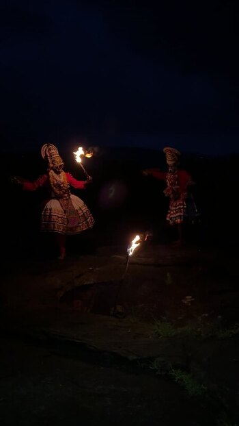 View of Kathakali performers with fire torches at night India. View of Kathakali performers with fire torches at night India.