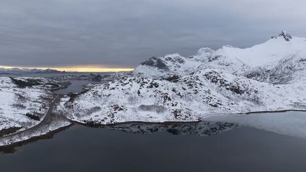 Aerial view of Lofoten mountains and coastal road Norway.