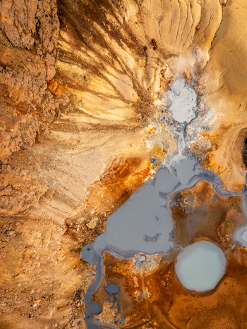 Aerial view of geothermal landscape with colorful mineral deposits and hot springs in Iceland. Aerial view of geothermal landscape with colorful mineral deposits and hot springs in Iceland.