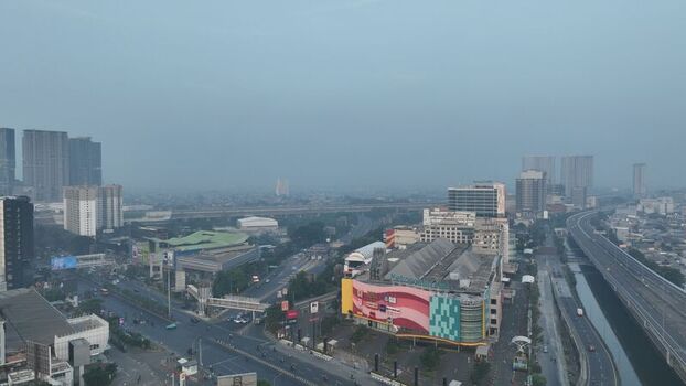 Bekasi Barat West Java Indonesia 20 June 2026 Aerial view of the urban landscape in Bekasi Barat featuring high rise buildings a shopping mall and a highway under a hazy sky. Bekasi Barat West Java Indonesia 20 June 2026 Aerial view of the urban landscape in Bekasi Barat featuring high rise buildings a shopping mall and a highway under a hazy sky.