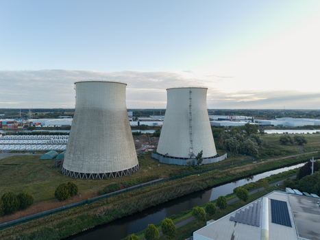 Aerial view of the cooling towers of the former power plant industrial infrastructure and a canal in Vilvoorde Flanders Belgium. Aerial view of the cooling towers of the former power plant industrial infrastructure and a canal in Vilvoorde Flanders Belgium.