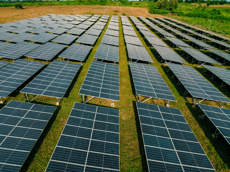 Aerial view of rows of solar panels installed in a field in Ogun State Nigeria.