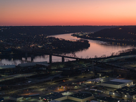 Aerial view of the river reflecting the sunset with bridges spanning across the water Cincinnati United States. Aerial view of the river reflecting the sunset with bridges spanning across the water Cincinnati United States.