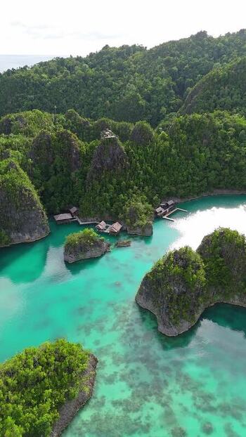Aerial view of Piaynemo karst islands in turquoise water Indonesia. Aerial view of Piaynemo karst islands in turquoise water Indonesia.