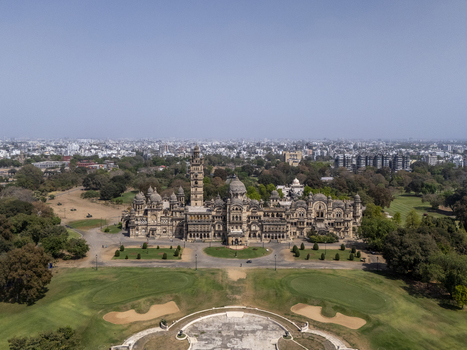 Vadodara India 14 March 2026 Aerial view of Laxmi Vilas Palace featuring its grand Indo Saracenic architecture ornate domes and tall tower surrounded by lush green gardens and a golf course. Vadodara India 14 March 2026 Aerial view of Laxmi Vilas Palace featuring its grand Indo Saracenic architecture ornate domes and tall tower surrounded by lush green gardens and a golf course.