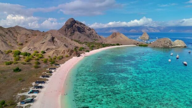 Aerial view of Pink Beach and rugged hills in Komodo National Park Indonesia. Aerial view of Pink Beach and rugged hills in Komodo National Park Indonesia.