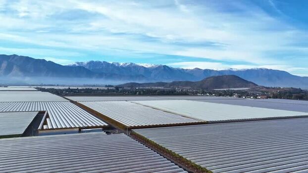 Aerial view of agricultural fields with greenhouses Chile.