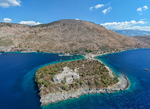 Aerial view of The Castle of Porto Palermo situated on a peninsula surrounded by the turquoise waters of the Ionian Sea Porto Palermo Qarku i Vlores Albania.