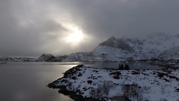 Aerial view of Lofoten mountains and snowy bay Norway.